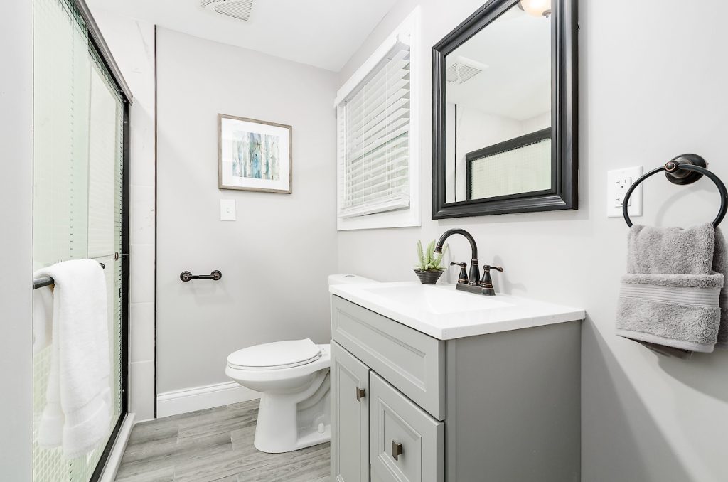 Revitalizing Neighborhoods, One House At A Time 11 A single sink and bathroom.