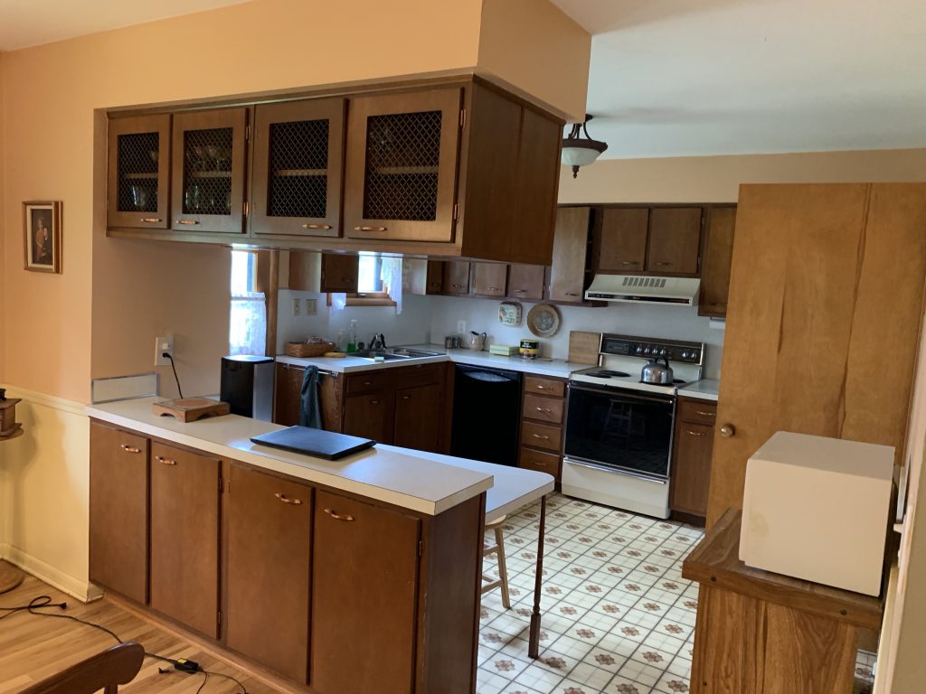 Revitalizing Neighborhoods, One House At A Time 5 A kitchen with linoleum floors.