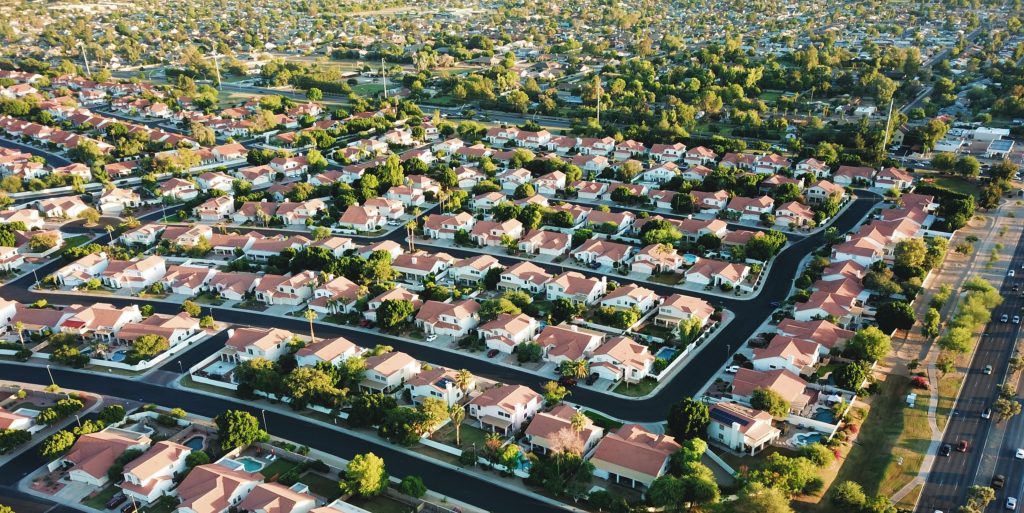 6 Great Ways to Lower Your Home Building Cost 5 A birds-eye view of a sprawling suburban neighborhood.