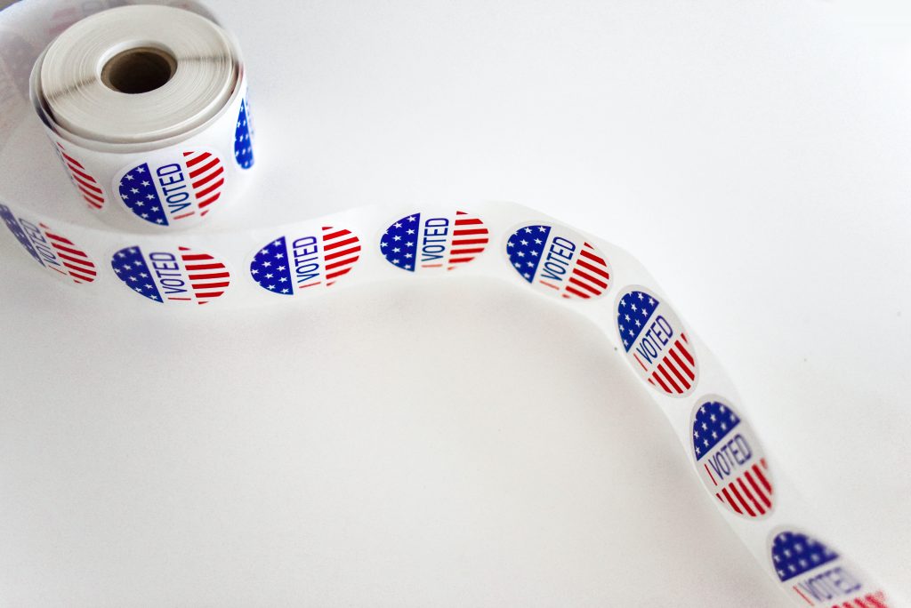 Is Selling Your House in an Election Year a Good Idea? 2 "I Voted" sticker roll on a white background during an election year.